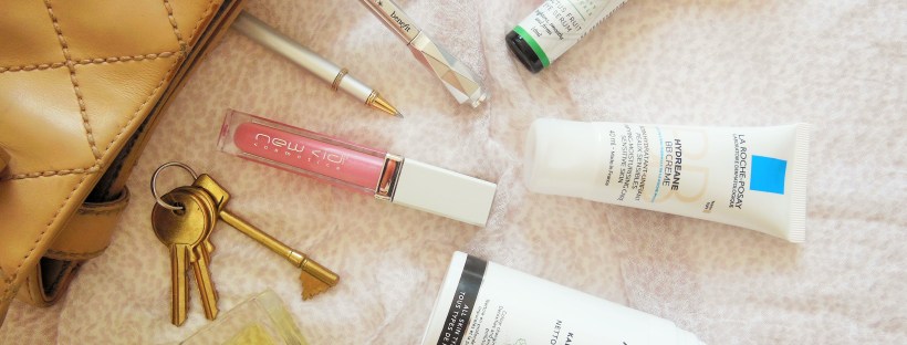 Beauty flatlay featuring skincare makeup and perfume