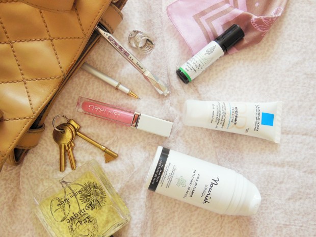 Beauty flatlay featuring skincare makeup and perfume