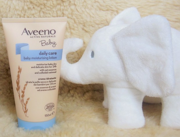 Aveeno Baby Daily Care Moisturising Lotion with white elephant cuddly toy