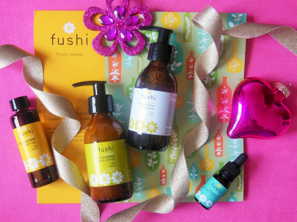 Fushi Rose and Jasmine Gift Set flatlay with Christmas decorations