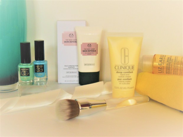 Beauty product range featuring nail polish, hand cream and hair oil