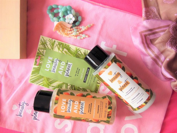 Shea Butter and Sandalwood shampoo and conditioner on a pink background