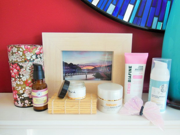 Face creams on shelf with photo frame