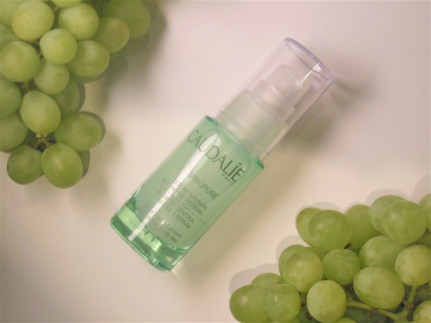 Caudalie Vinopure skincare flatlay with green grapes