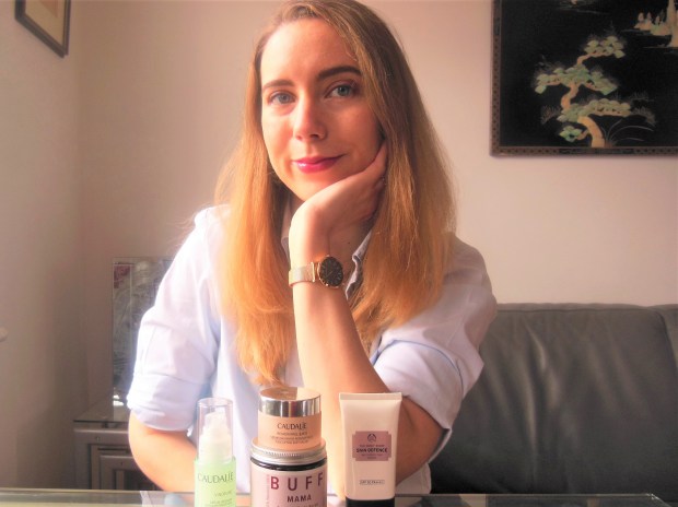 Portrait with skincare products on table