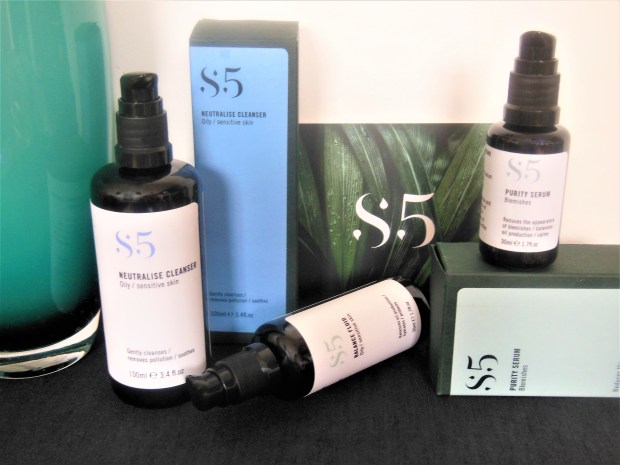 Three black pump dispensers from the S5 skincare range