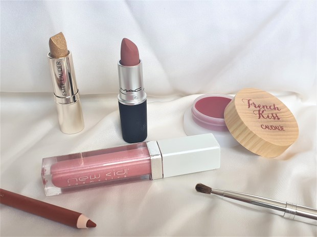 Lip products on white background