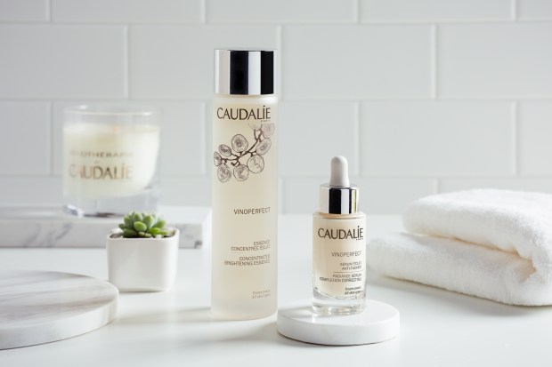 Caudalie skincare products in white bathroom