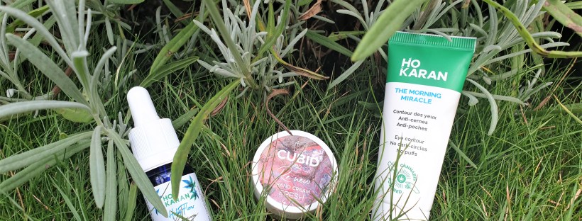 CBD oil skincare products on grass