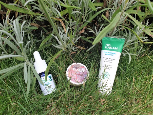 CBD oil skincare products on grass