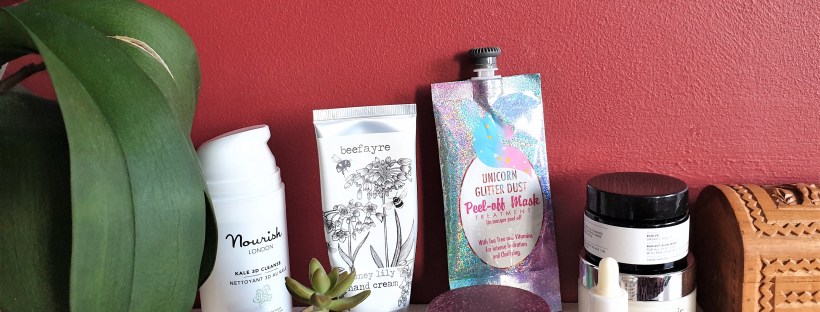 Top skincare products on a white shelf with red background