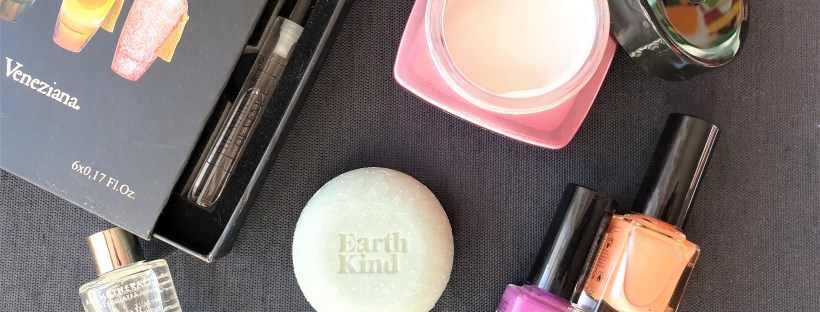 Beauty products flatlay with fragrance, bath essence, cream, soap and nail polish