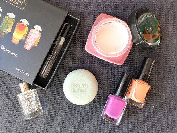 Beauty products flatlay with fragrance, bath essence, cream, soap and nail polish
