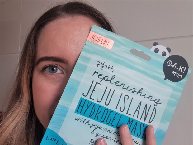 blogger holding sheet mask